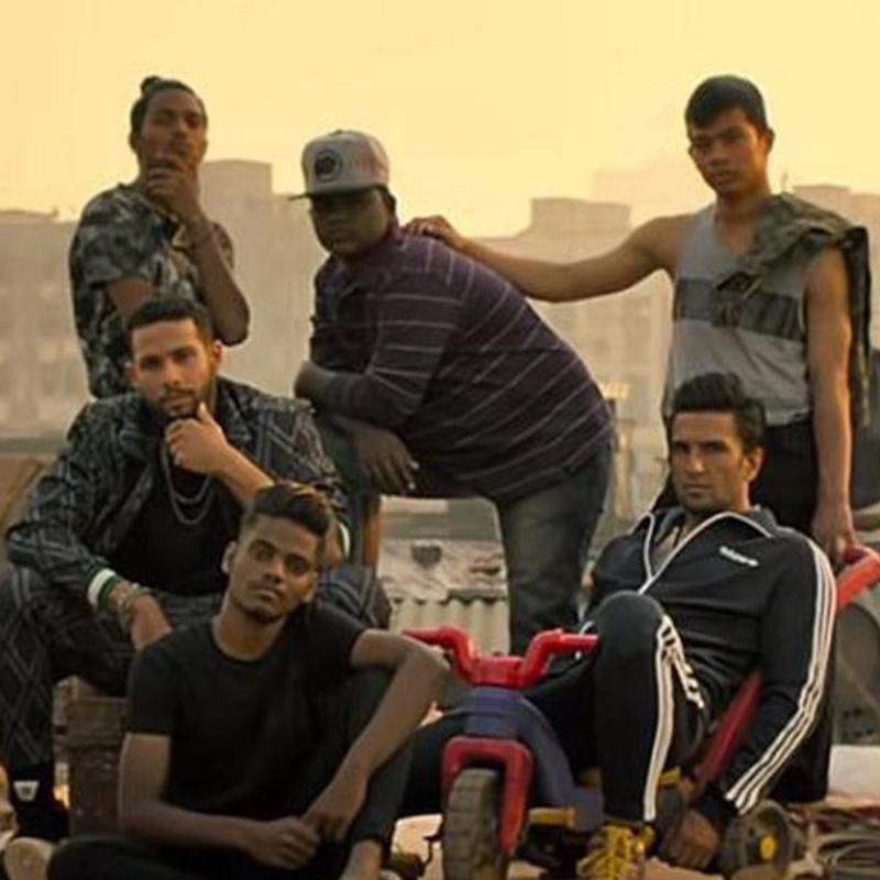 An image taken of six individuals with two more individuals in the background 