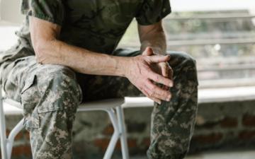 Close-up of a military veterans hands in a therapy session, emphasizing mental health support. RDNE Stock Project via Pexels. 