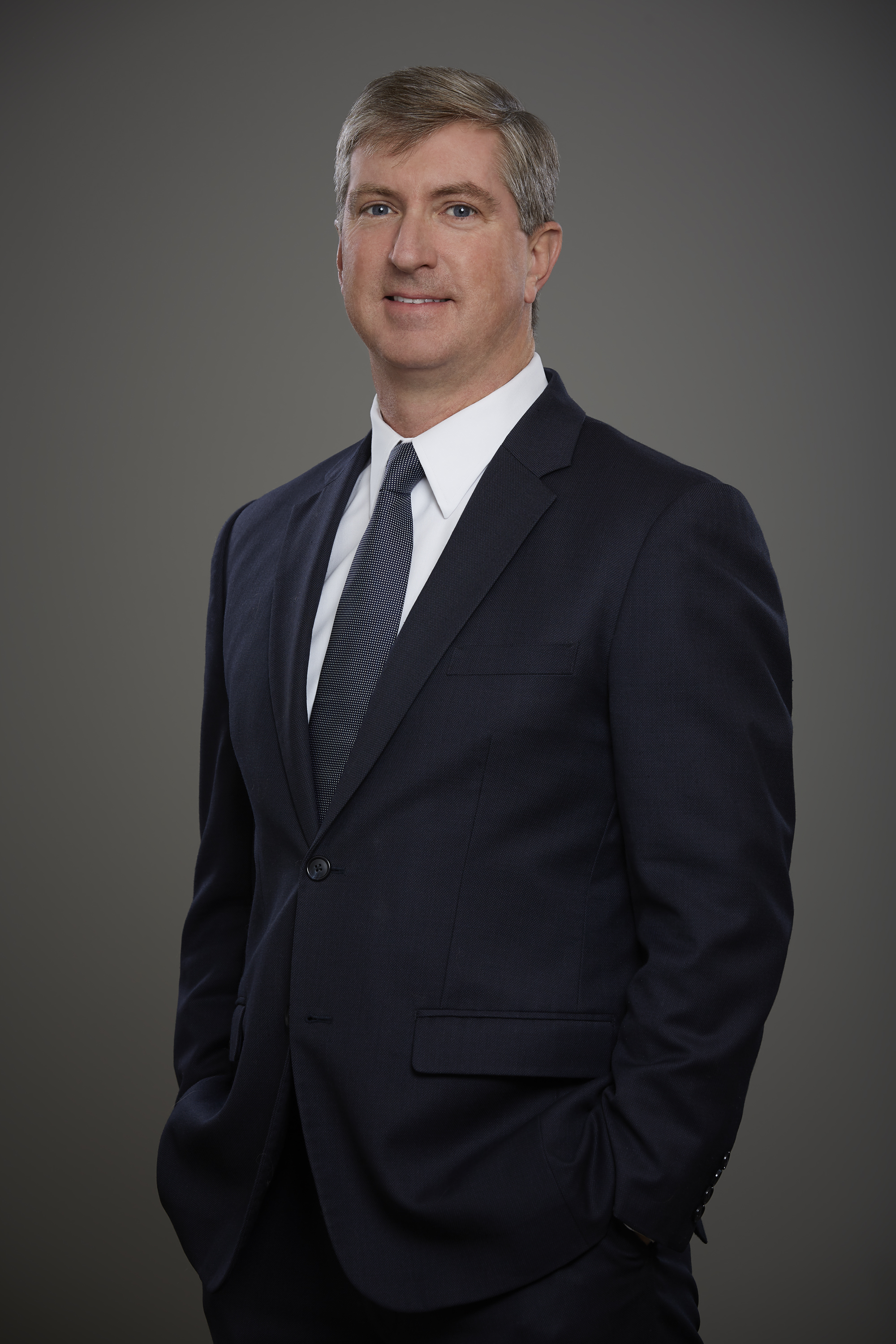 Man in Suit Smiling at Camera