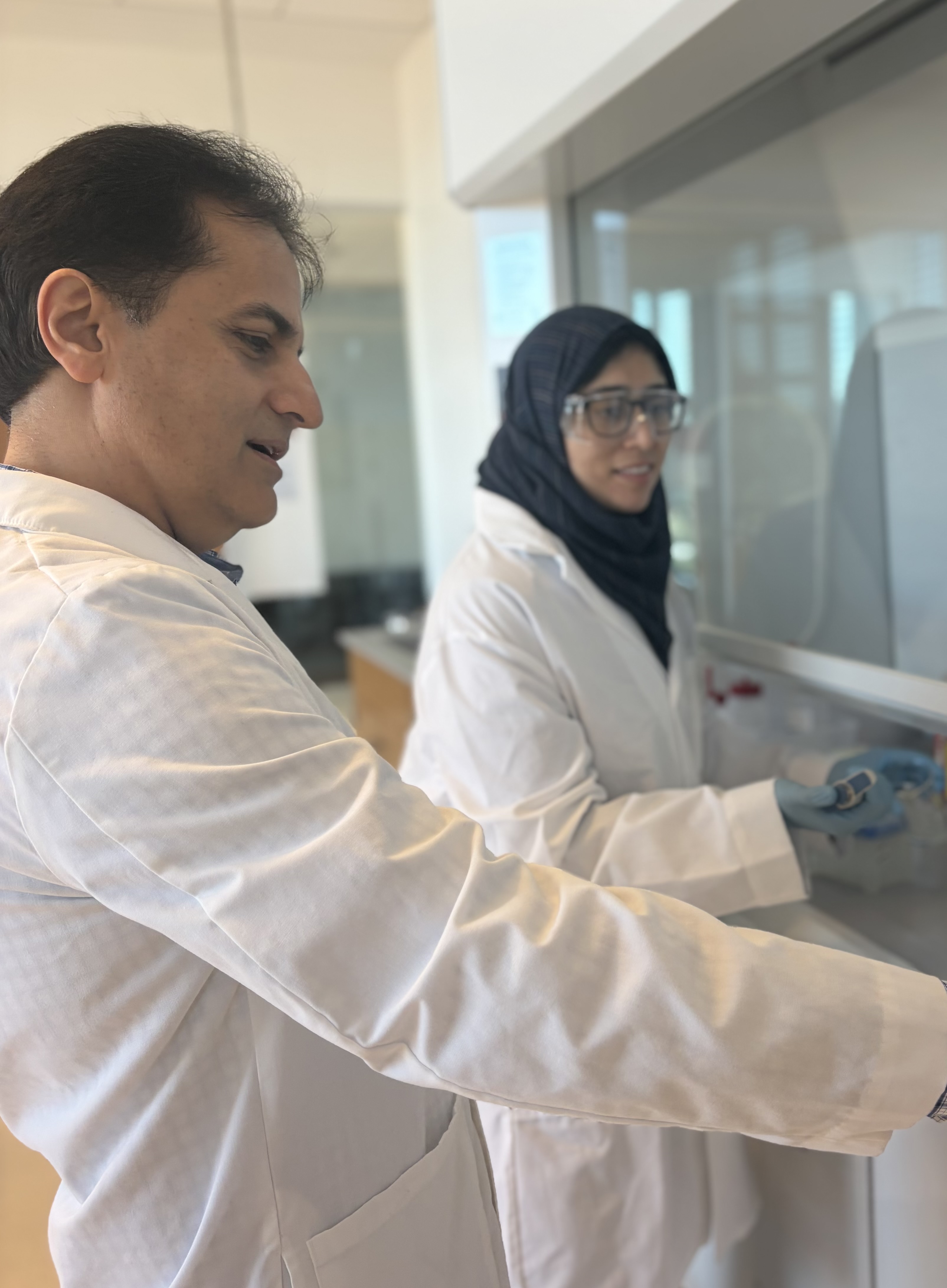 Dr. Akbari in the Lab with his PhD Student